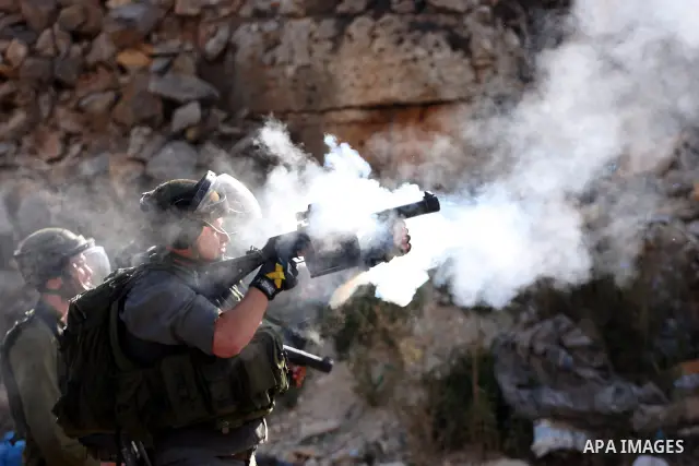 Israeli forces clash with Palestinian protestors following a demonstration calling for the release of prisoners held in Israeli jails and in support of inmates in hunger strike, on October 11, 2011 near Israel's Ofer pri...