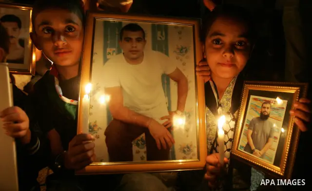 Palestinians take part in a protest calling for the release of Palestinian prisoners from Israeli jails and in support of inmates in hunger strike on October 11, 2011 outside Damascus Gate in Jerusalem's Old City. Accord...
