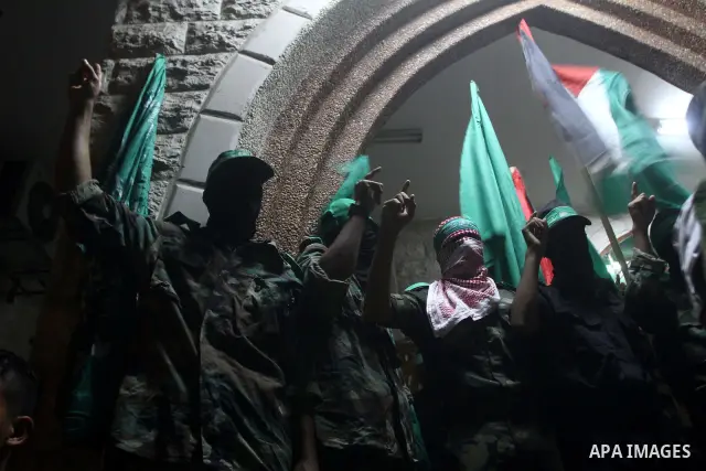 Palestinian members of Hamas celebrate a deal that will see Palestinian detainees freed in exchange for captured Israeli soldier Gilad Shalit on October 11, 2011, in Deir al-Balah in the central Gaza Strip. Shalit was ca...
