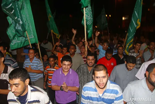Palestinian members of Hamas celebrate a deal that will see Palestinian detainees freed in exchange for captured Israeli soldier Gilad Shalit on October 11, 2011, in Deir al-Balah in the central Gaza Strip. Shalit was ca...