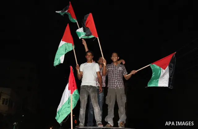 Palestinian members of Hamas celebrate a deal that will see Palestinian detainees freed in exchange for captured Israeli soldier Gilad Shalit on October 11, 2011, in Gaza City. Shalit was captured in 2006 by Hamas-allied...