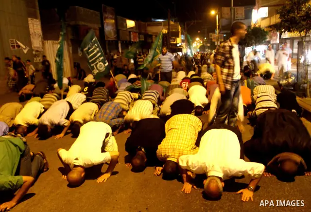Palestinian members of Hamas celebrate a deal that will see Palestinian detainees freed in exchange for captured Israeli soldier Gilad Shalit on October 11, 2011, in Deir al-Balah in the central Gaza Strip. Shalit was ca...