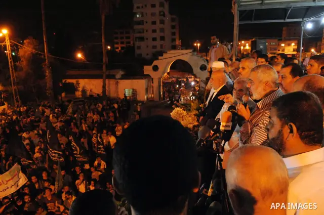 Palestinian prime minister in Gaza Strip, Ismail Haniya takes part in a rally celebrating news of a prisoner swap between Hamas and Israel, in Gaza City October 11, 2011. Israel and Gaza's Hamas Islamist rulers agreed on...