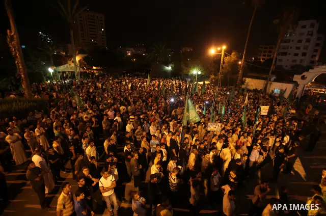 Palestinian members of Hamas celebrate a deal that will see Palestinian detainees freed in exchange for captured Israeli soldier Gilad Shalit on October 11, 2011, in Gaza City. Shalit was captured in 2006 by Hamas-allied...