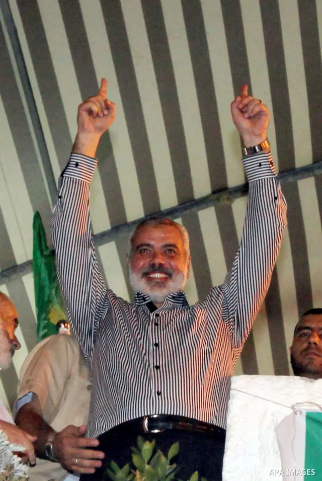Palestinain prime minister in gaza , Ismail Haniyeh, chants slogans as he takes part in a rally celebrating news of a prisoner swap between Hamas and Israel, in Gaza City October 11, 2011. Israel and Gaza's Hamas Islamis...