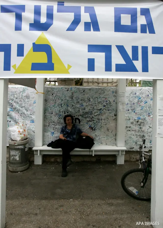Friends and supporters of Noam and Aviva Shalit, parents of abducted Israeli soldier Gilad Shalit who was captured in 2006 by Hamas-allied militants in the Gaza Strip, gather at the family's protest tent on the 1,935th d...