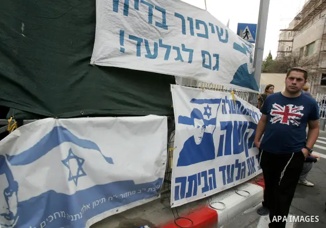 Friends and supporters of Noam and Aviva Shalit, parents of abducted Israeli soldier Gilad Shalit who was captured in 2006 by Hamas-allied militants in the Gaza Strip, gather at the family's protest tent on the 1,935th d...