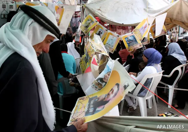 Palestinians take part in a protest calling for the release of Palestinian prisoners from Israeli jails, in the West Bank city of Nablus, Wednesday, Oct. 12, 2011. Israelis welcomed on Wednesday a major prisoner swap tha...