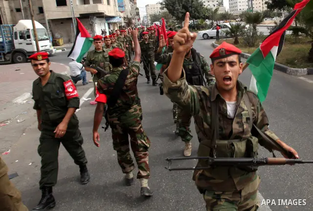 Members of Hamas national security forces Ca street as they celebrate a prisoner swap between Hamas and Israel, in Gaza City October 12, 2011. Prospects of a long-elusive deal with Hamas to secure the release of Israeli...