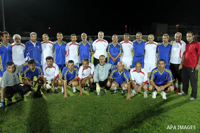 Palestinian prime minister in Gaza Strip, Ismail Haniya participate in football match in solidarity with prisoners jailed in Israel in front of the International Red Cross building in Gaza City, Wednesday, Oct. 12, 2011....