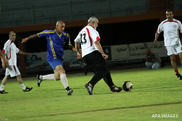 Palestinian prime minister in Gaza Strip, Ismail Haniya participate in football match in solidarity with prisoners jailed in Israel in front of the International Red Cross building in Gaza City, Wednesday, Oct. 12, 2011....