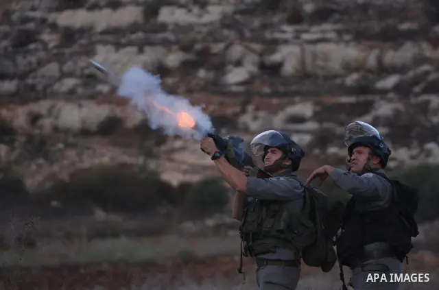 Israeli forces clash with Palestinian protestors following a demonstration calling for the release of prisoners held in Israeli jails and in support of inmates in hunger strike, on October 12, 2011 near Israel?s Ofer pri...