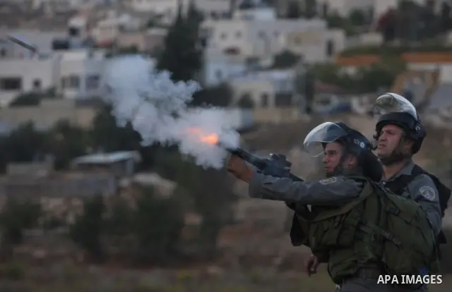Israeli forces clash with Palestinian protestors following a demonstration calling for the release of prisoners held in Israeli jails and in support of inmates in hunger strike, on October 12, 2011 near Israel?s Ofer pri...