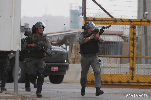 Israeli forces clash with Palestinian protestors following a demonstration calling for the release of prisoners held in Israeli jails and in support of inmates in hunger strike, on October 12, 2011 near Israel?s Ofer pri...