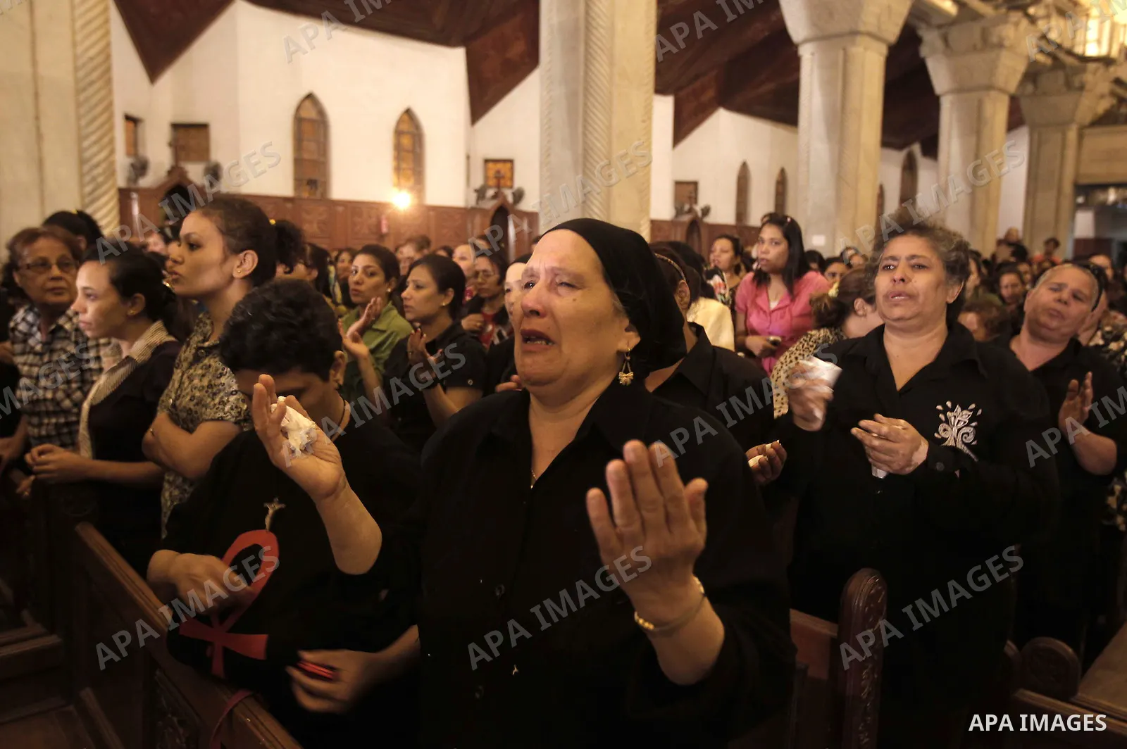 Nearly 3,000 Egyptian mourners gather in central Cairo on October 13, 2011 in honour of Coptic Christians among 25 people killed in weekend clashes during a demonstration over an attack on a church. Egypt's government sa...