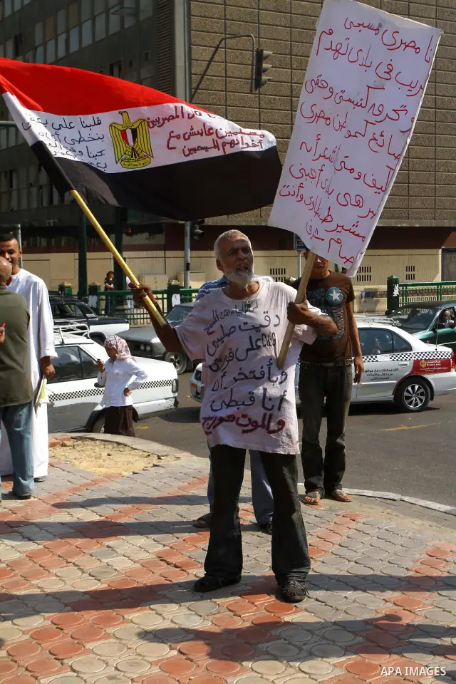 Egyptian protesters shout slogans during a demonstration outside a mosque in Cairo in support of national unity that led to a clash between pro- and anti-military supporters on October 14, 2011. The military has run Egyp...