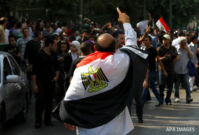 Egyptian protesters shout slogans during a demonstration outside a mosque in Cairo in support of national unity that led to a clash between pro- and anti-military supporters on October 14, 2011. The military has run Egyp...