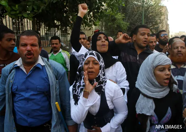 Egyptian protesters shout slogans during a demonstration outside a mosque in Cairo in support of national unity that led to a clash between pro- and anti-military supporters on October 14, 2011. The military has run Egyp...