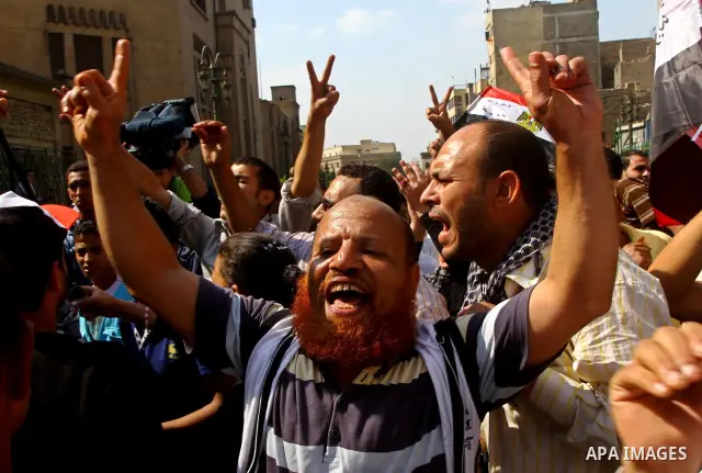 Egyptian protesters shout slogans during a demonstration outside a mosque in Cairo in support of national unity that led to a clash between pro- and anti-military supporters on October 14, 2011. The military has run Egyp...