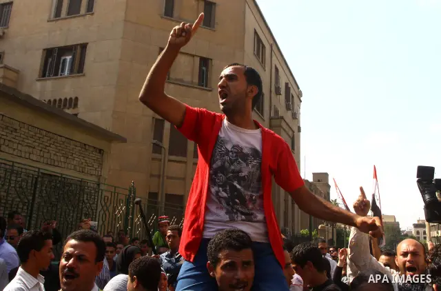 Egyptian protesters shout slogans during a demonstration outside a mosque in Cairo in support of national unity that led to a clash between pro- and anti-military supporters on October 14, 2011. The military has run Egyp...