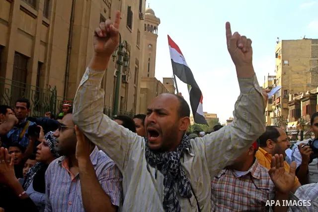 Egyptian protesters shout slogans during a demonstration outside a mosque in Cairo in support of national unity that led to a clash between pro- and anti-military supporters on October 14, 2011. The military has run Egyp...