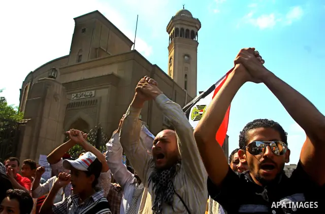 Egyptian protesters shout slogans during a demonstration outside a mosque in Cairo in support of national unity that led to a clash between pro- and anti-military supporters on October 14, 2011. The military has run Egyp...