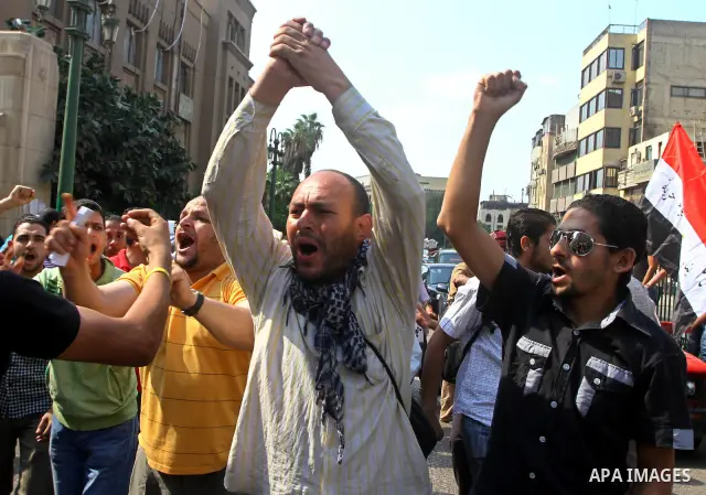 Egyptian protesters shout slogans during a demonstration outside a mosque in Cairo in support of national unity that led to a clash between pro- and anti-military supporters on October 14, 2011. The military has run Egyp...