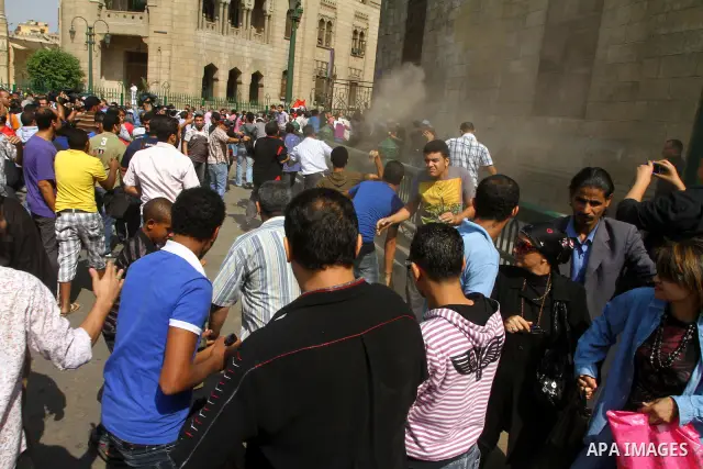 Egyptian pro- and anti-military supporters clash during a demonstration in support of national unity outside a mosque in Cairo on October 14, 2011. The military has run Egypt since president Hosni Mubarak was ousted in F...