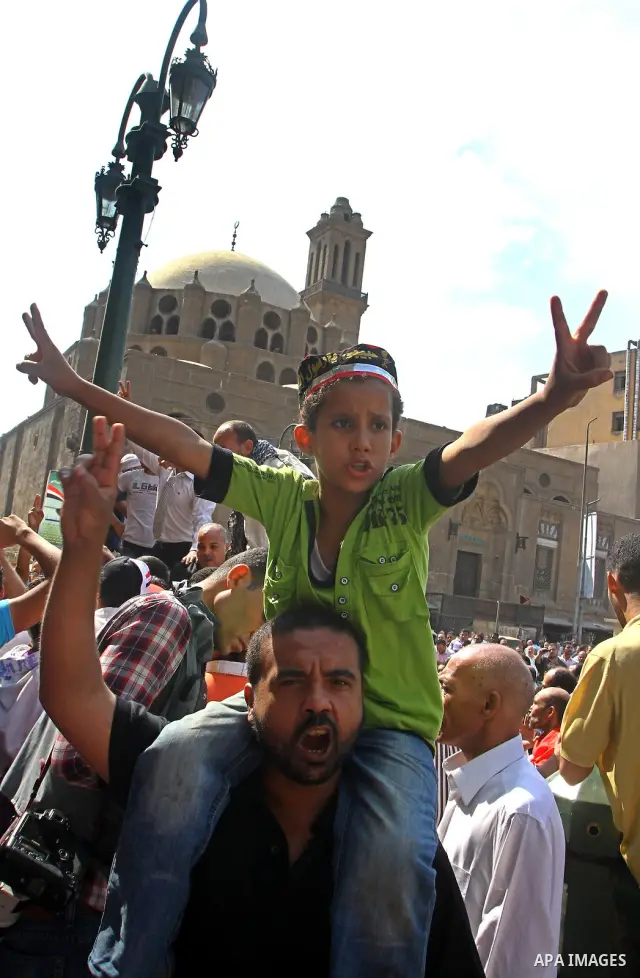 Egyptian protesters shout slogans during a demonstration outside a mosque in Cairo in support of national unity that led to a clash between pro- and anti-military supporters on October 14, 2011. The military has run Egyp...