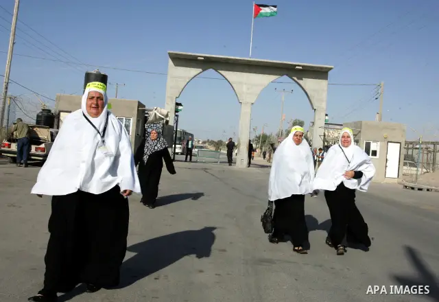 Palestinian pilgrims arrive at the Rafah border crossing between the Gaza Strip and Egypt on their way to the annual hajj or pilgrimage in the Saudi Muslim holy city of Mecca, on October 14, 2011. Photo by Abed Rahim Kha...
