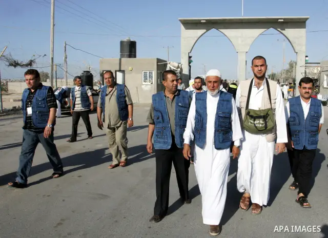 Palestinian pilgrims arrive at the Rafah border crossing between the Gaza Strip and Egypt on their way to the annual hajj or pilgrimage in the Saudi Muslim holy city of Mecca, on October 14, 2011. Photo by Abed Rahim Kha...