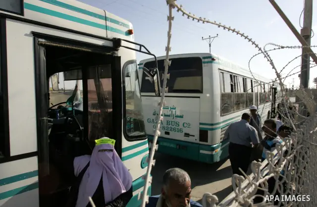 Palestinian pilgrims arrive at the Rafah border crossing between the Gaza Strip and Egypt on their way to the annual hajj or pilgrimage in the Saudi Muslim holy city of Mecca, on October 14, 2011. Photo by Abed Rahim Kha...