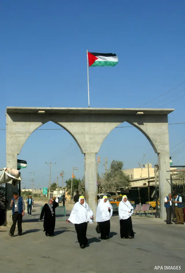 Palestinian pilgrims arrive at the Rafah border crossing between the Gaza Strip and Egypt on their way to the annual hajj or pilgrimage in the Saudi Muslim holy city of Mecca, on October 14, 2011. Photo by Abed Rahim Kha...