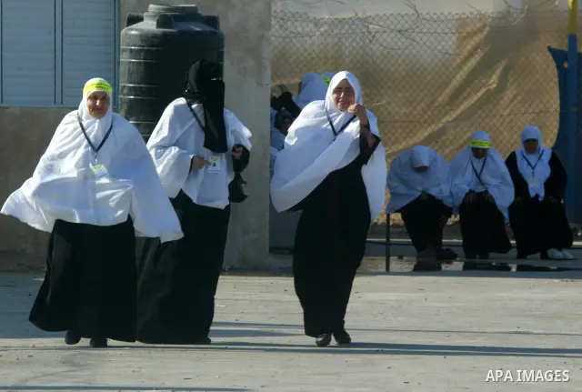 Palestinian pilgrims arrive at the Rafah border crossing between the Gaza Strip and Egypt on their way to the annual hajj or pilgrimage in the Saudi Muslim holy city of Mecca, on October 14, 2011. Photo by Abed Rahim Kha...