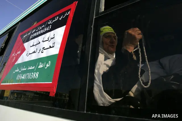 Palestinian pilgrims arrive at the Rafah border crossing between the Gaza Strip and Egypt on their way to the annual hajj or pilgrimage in the Saudi Muslim holy city of Mecca, on October 14, 2011. Photo by Abed Rahim Kha...