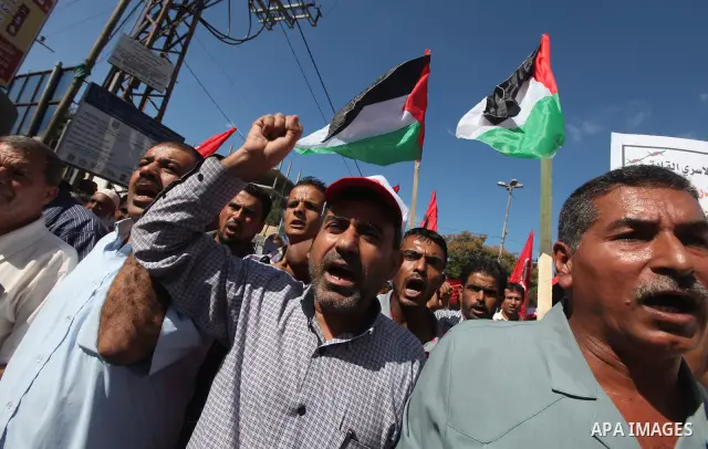 Palestinian relatives prisoners attend a protest calling for the release of their sons held in Israeli jails next the International Red Cross in Gaza City, Gaza Strip, on Oct. 15, 2011. Captive Israeli soldier Gilad Shal...