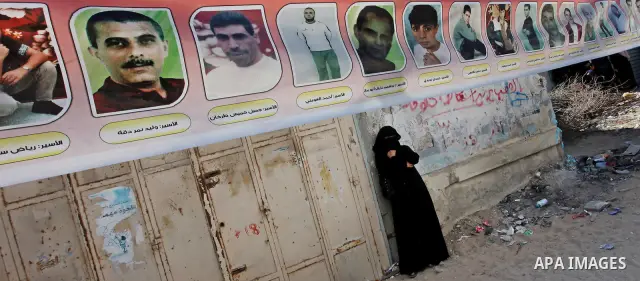 Palestinian relatives prisoners attend a protest calling for the release of their sons held in Israeli jails next the International Red Cross in Gaza City, Gaza Strip, on Oct. 15, 2011. Captive Israeli soldier Gilad Shal...
