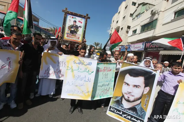 Palestinian relatives prisoners attend a protest calling for the release of their sons held in Israeli jails next the International Red Cross in Gaza City, Gaza Strip, on Oct. 15, 2011. Captive Israeli soldier Gilad Shal...