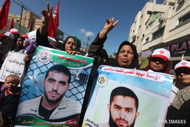 Palestinian relatives prisoners attend a protest calling for the release of their sons held in Israeli jails next the International Red Cross in Gaza City, Gaza Strip, on Oct. 15, 2011. Captive Israeli soldier Gilad Shal...