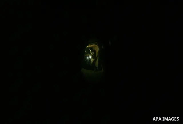 Palestinian men smuggle gravels into the Gaza Strip through a tunnel under the Egypt-Gaza border in Rafah on Oct. 16, 2011. Israel released a list of 477 Palestinian prisoners to be released next week as part of the deal...
