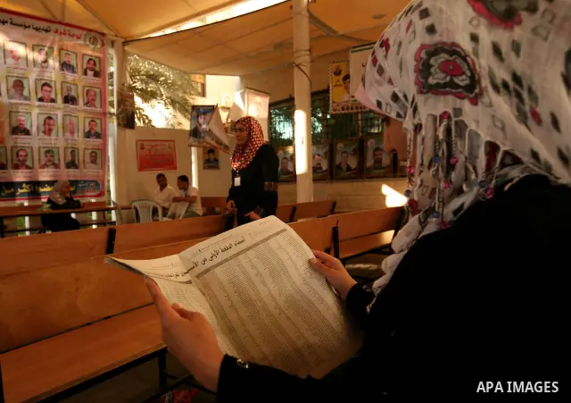 Palestinians look at the lists of Palestinian prisoners, who are to be exchanged for captured Israeli soldier Gilad Schalit, published in the newspapers in Gaza City, Sunday, Oct. 16, 2011. The relatives of Israelis kill...