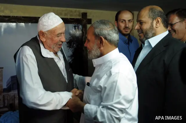Palestinian Prime Minister in Gaza Strip, Ismail Haniyeh visits with his ministers and legislators one of Hamas founders, Abed el-Fatah Doukhan in Gaza City, Sunday, Oct. 16, 2011. The relatives of Israelis killed in Pal...