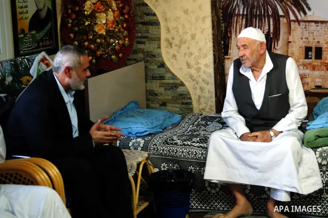 Palestinian Prime Minister in Gaza Strip, Ismail Haniyeh visits with his ministers and legislators one of Hamas founders, Abed el-Fatah Doukhan in Gaza City, Sunday, Oct. 16, 2011. The relatives of Israelis killed in Pal...