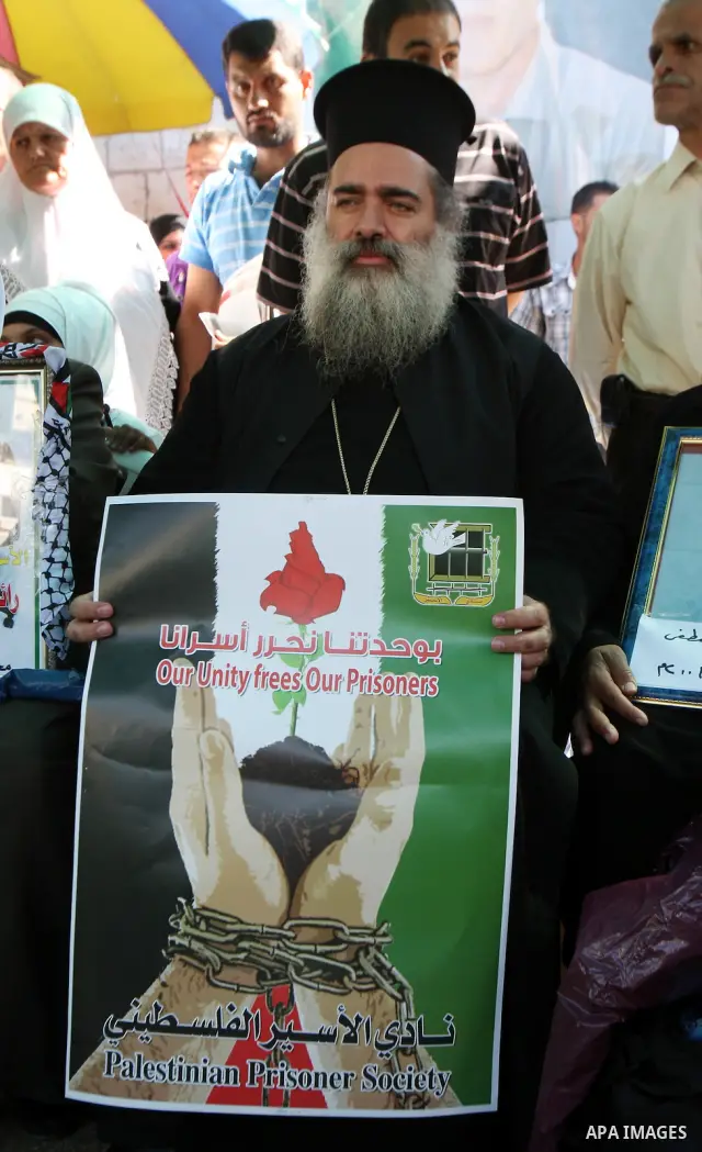 Atallah Hanna spokesman of the Greek Orthodox Church in Jerusalem take part in a protest calling for the release of Palestinian prisoners from Israeli jails, in the West Bank city of Nablus, Monday Oct. 17, 2011 . Photo...