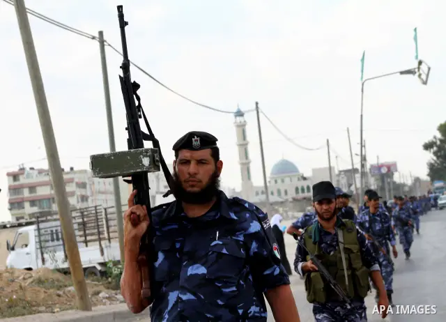 Palestinian Hamas policemen patrol in the central Gaza Strip October 17, 2011, as they patrol during preparations for the release of prisoners in a swap that is expected to take place on Tuesday. Hamas prepared a heroes'...