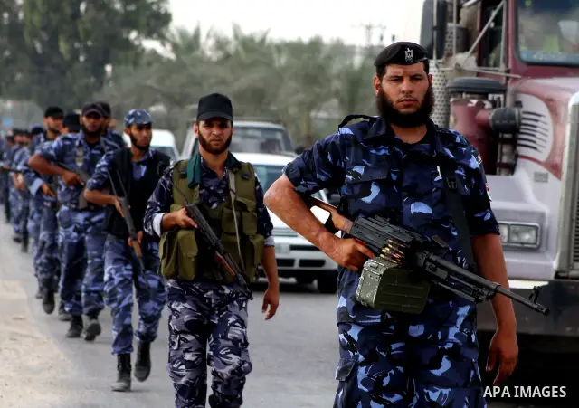 Palestinian Hamas policemen patrol in the central Gaza Strip October 17, 2011, as they patrol during preparations for the release of prisoners in a swap that is expected to take place on Tuesday. Hamas prepared a heroes'...