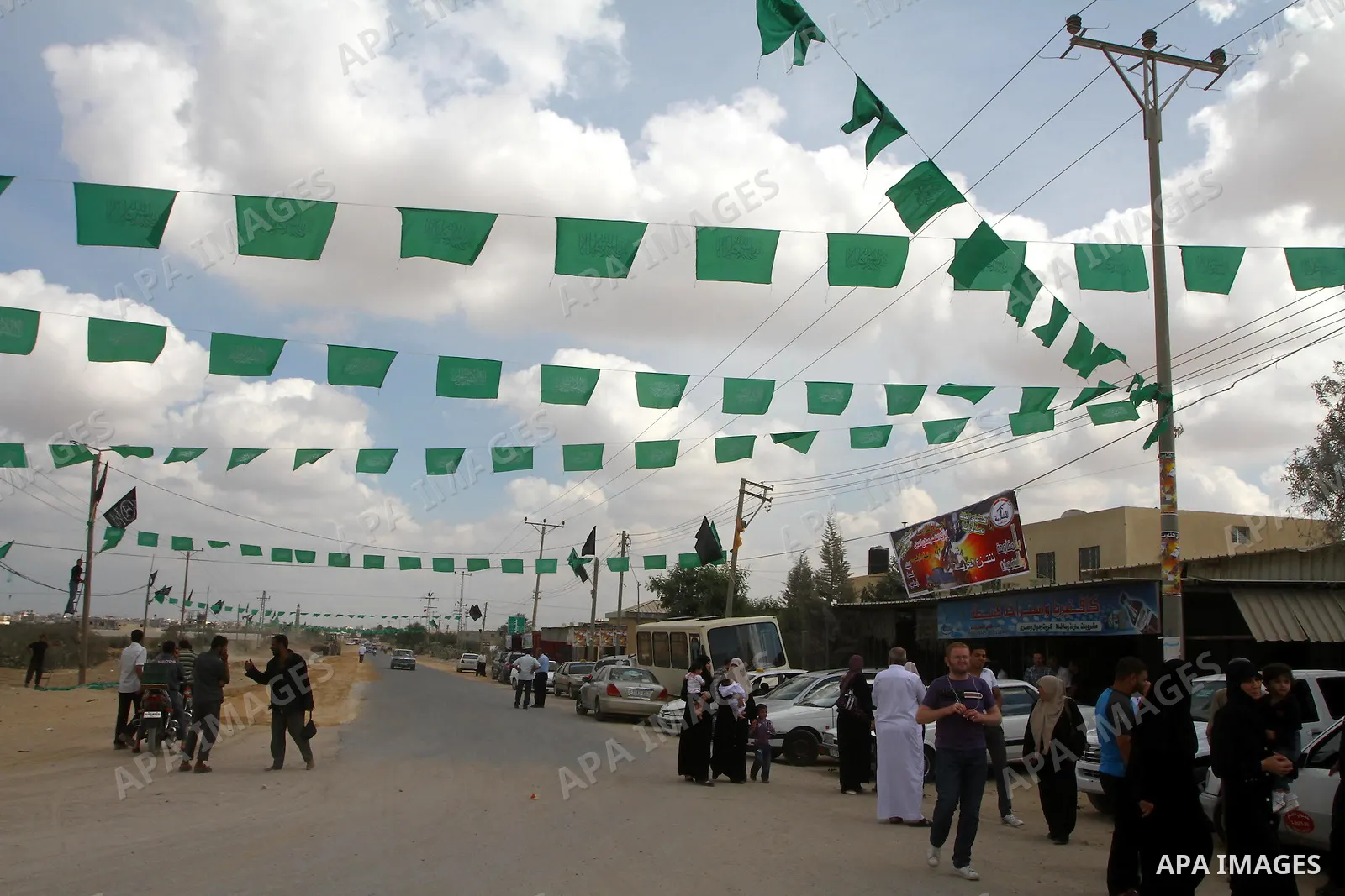 Palestinians gather at the Rafah border crossing in the southern Gaza Strip October 17, 2011, during preparations for the release of prisoners in a swap that is expected to take place on Tuesday. Hamas prepared a heroes'...