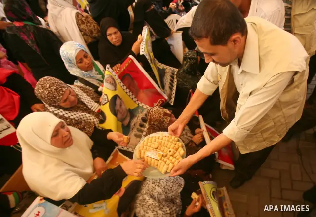Palestinians gather during a protest at the Red Cross' offices in Gaza City to call for the release of Palestinian prisoners held in Israeli jails, on October 17, 2011. Under a prisoner swap deal signed with Israel, the...