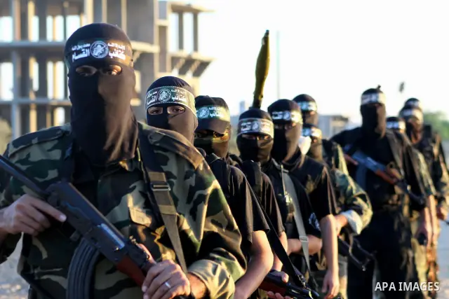 Armed Palestinian Hamas militants keep patrol near the Rafah crossing with Egypt in the southern Gaza Strip on October 18, 2011 as an Israeli-Palestinian prisoner swap deal gets under way. Buses carrying 477 Palestinian...