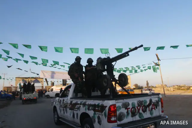 Armed Palestinian Hamas militants keep patrol near the Rafah crossing with Egypt in the southern Gaza Strip on October 18, 2011 as an Israeli-Palestinian prisoner swap deal gets under way. Buses carrying 477 Palestinian...
